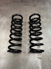 300lb, 3.5” dia, 10” tall coil (rear)