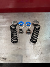300lb, 3.5” dia, 10” tall coil (rear)